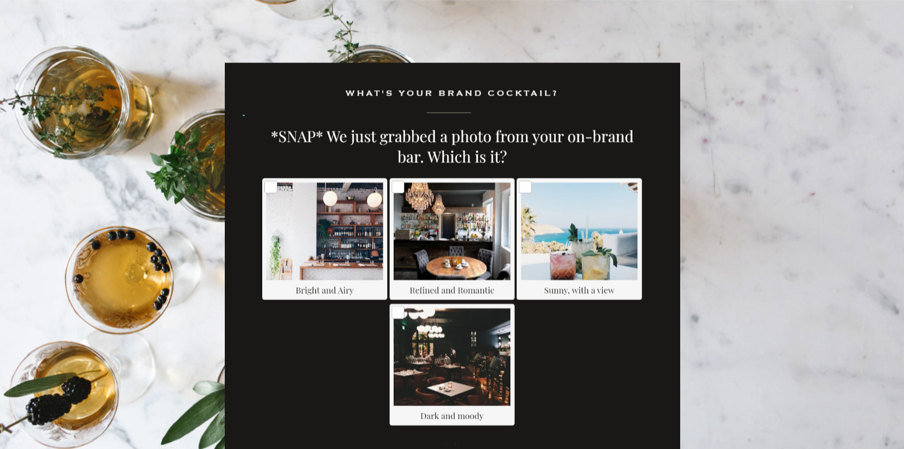 The quiz offers four inspiration photos to choose from for the reader’s “on-brand bar.” In the background, cocktails with herb and fruit garnishes sit on a marble tabletop.